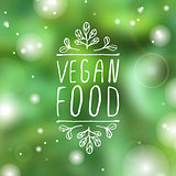 Vegan food - product label on blurred background