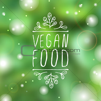 Vegan food - product label on blurred background