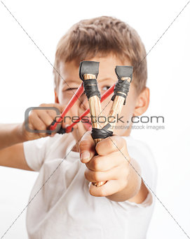 little cute angry boy with slingshot isolated