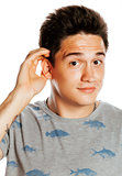 young pretty man isolated hand to ear surprised listening