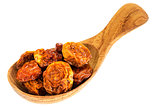 dried goldenberries on  wooden spoon