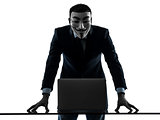 man masked anonymous group member computing computer silhouette