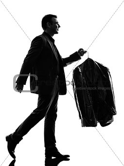 business man holding dry clean clothes  silhouette