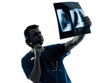 doctor surgeon radiologist on the phone examining lung torso  x-