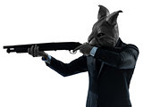 man with rabbit mask hunting with shotgun silhouette portrait