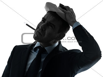 man sick with thermometer and ice pack silhouette portrait