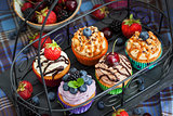 Set of different delicious cupcakes