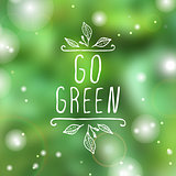 Go green - product label on blurred background.
