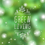 Green living - product label on blurred background.