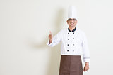 Handsome Indian male chef in uniform thumb up