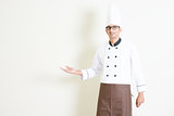 Indian male chef in uniform welcoming
