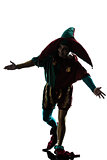 man in jester costume silhouette saluting