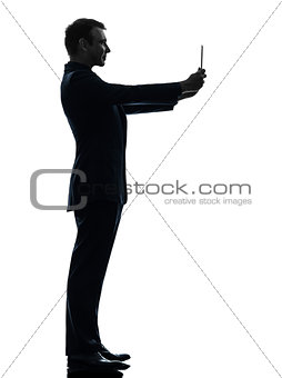 business man  photographing digital tablet  silhouette
