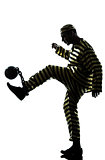 man prisoner criminal playing soccer with chain ball silhouette