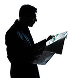 silhouette man portrait reading newspaper