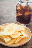 Crispy potato chips with iced cola