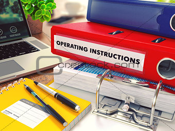 Operating Instructions on Red Office Folder. Toned Image.