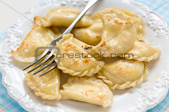 Fried in butter dumplings with cottage cheese.