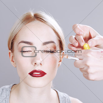 Professional Make-up artist applying makeup.