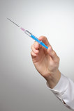 Doctor's hand with syringe