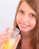Teenage girls drinking orange juice