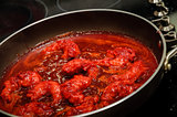 Shrimps with red sauce