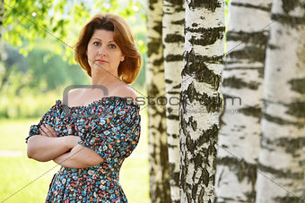 woman in a dress with open shoulders is about Birch