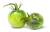 Two green tomatoes near