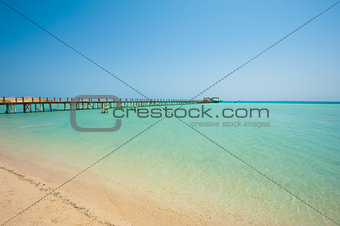 Wooden jetty on a tropical island beach
