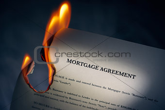 Mortgage Agreement Contract Burning On Fire