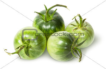 Four green tomatoes near