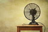 Old electric fan on table with retro look