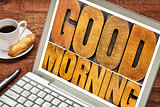 good morning in wood type on laptop