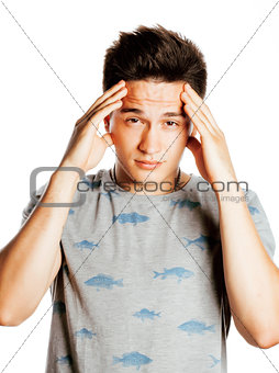 young pretty man with head ache holding hands isolated
