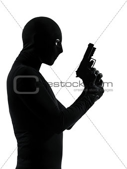 thief criminal terrorist holding gun portrait silhouette