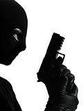 thief criminal terrorist holding gun portrait silhouette