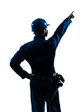 man construction worker pointing showing silhouette portrait