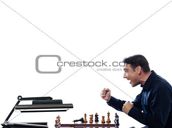 Man playing chess against computer