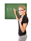 Teacher writting on chalkboard