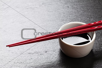 Japanese sushi chopsticks over soy sauce bowl