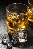 Glasses of whiskey with ice