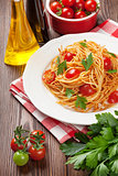 Spaghetti pasta with tomatoes and parsley
