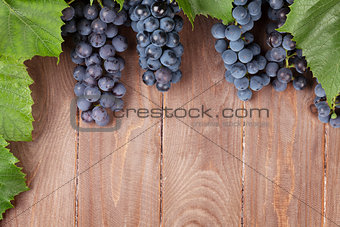 Red grape on wooden table