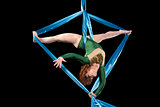 Gymnast training on aerial silks