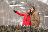 Couple crossing a bridge in winter holidays