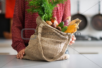 Closeup of burlap sac filled with autumn vegetables
