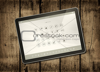 Digital tablet PC on a dark wood table