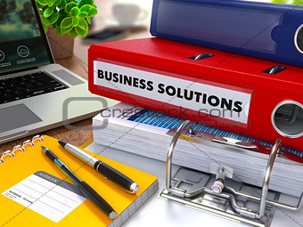 Red Ring Binder with Inscription Business Solutions.