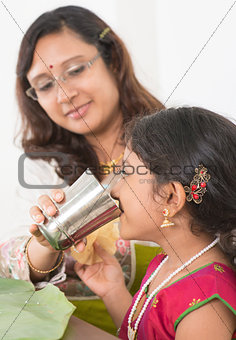 Indian girl drinking water