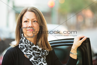 Confident Woman Near Car